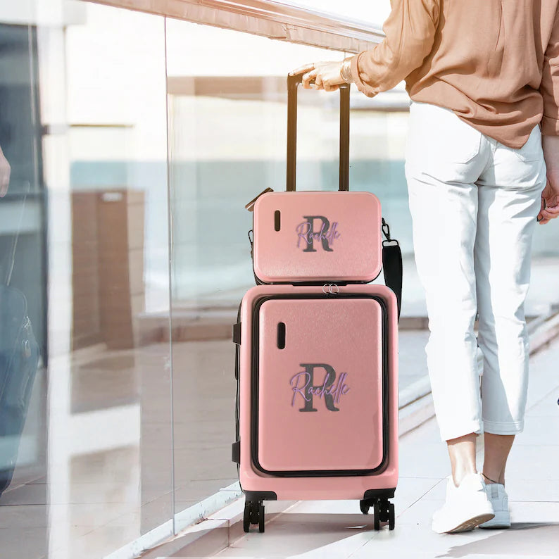 Personalized pink hardshell luggage set with custom monogram initial and name