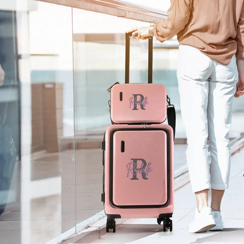 Personalized pink hardshell luggage set with custom monogram initial and name